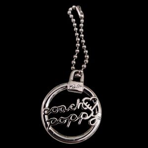 Coach Poppy Silver Circle Pendant Necklace